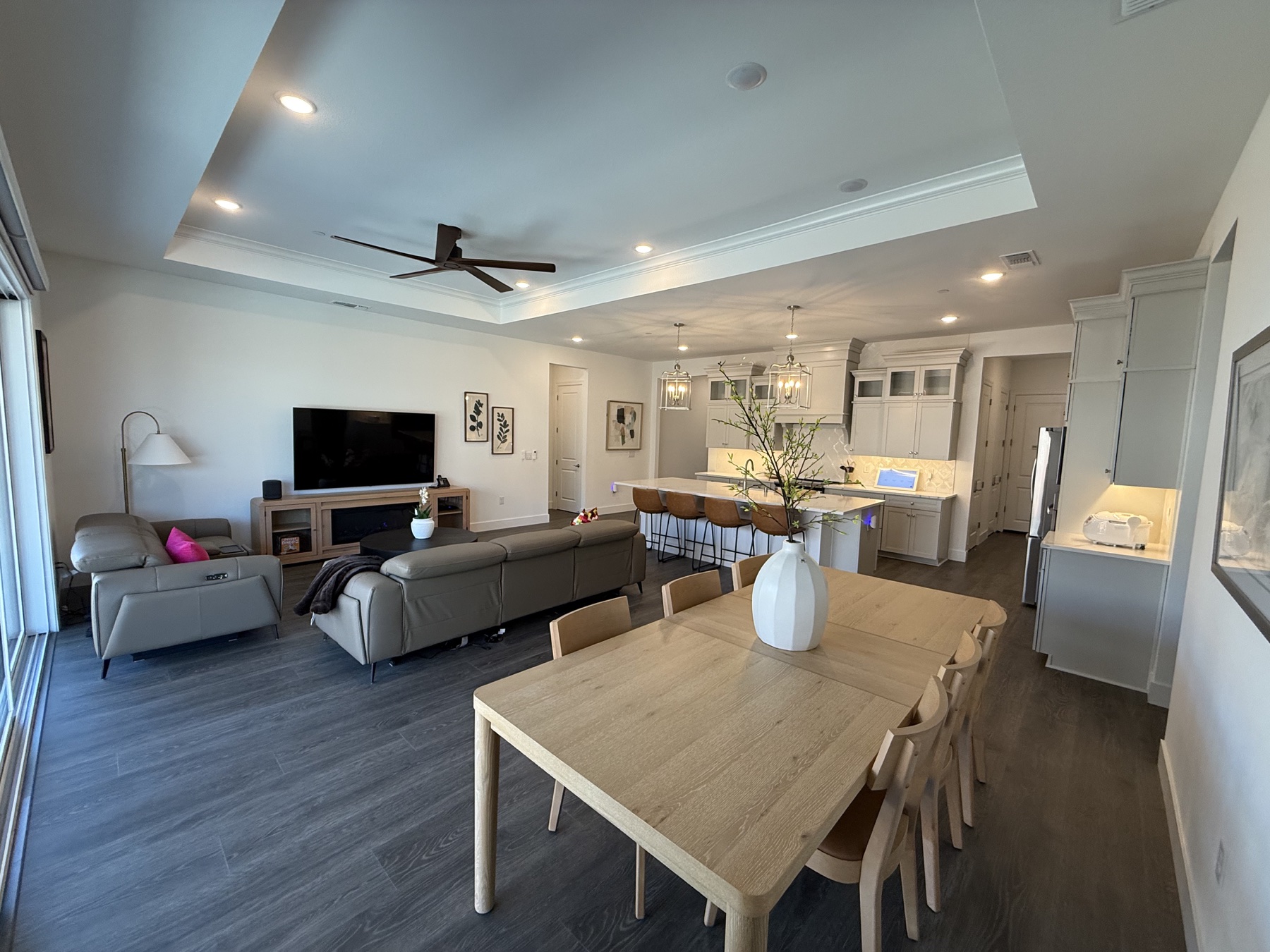 Vista Bella's bright open-concept living room, dining area, and kitchen